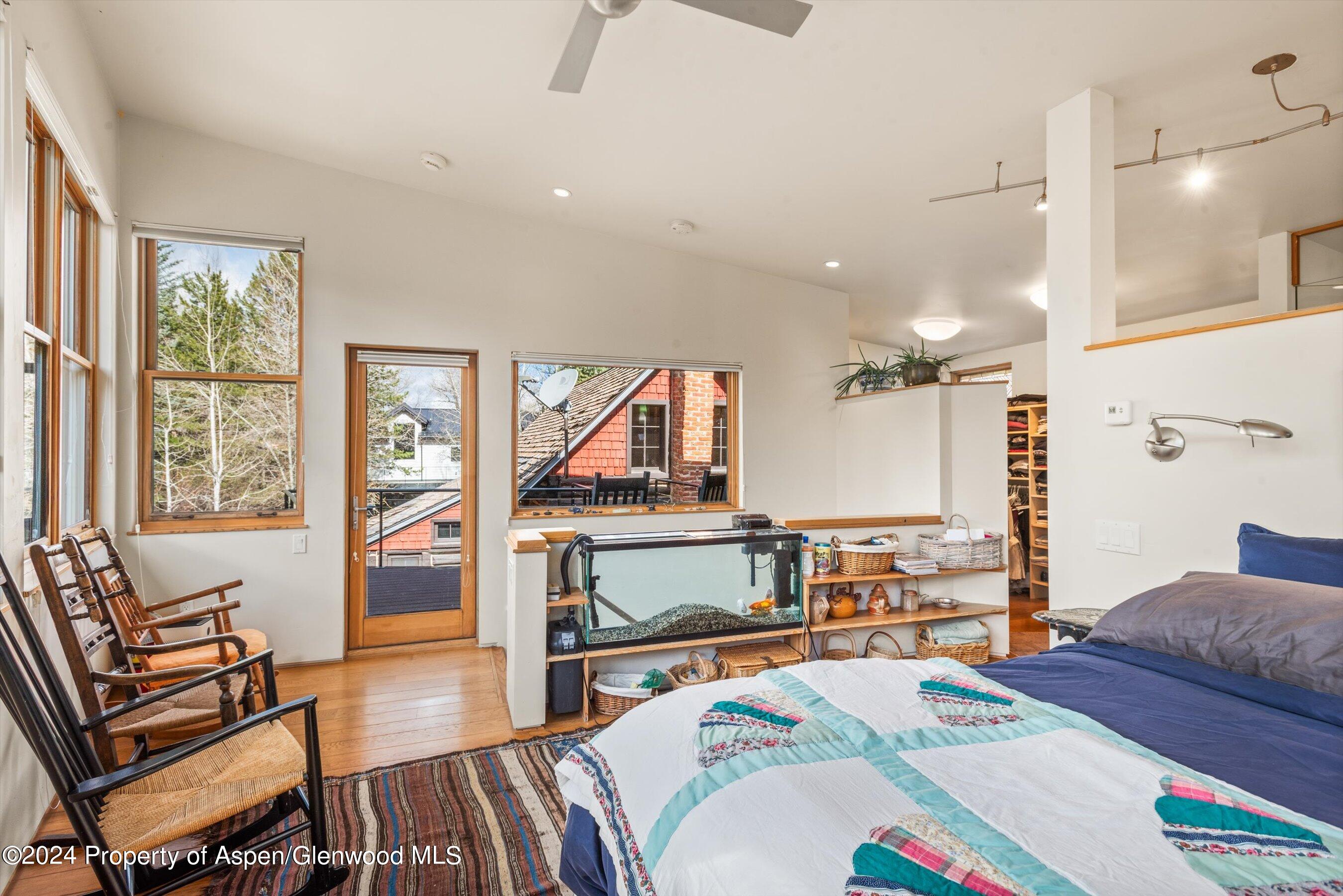 308 Park Avenue Aspen, CO 81611 - Photo 9 of 26 a bedroom with a bed and wooden floor
