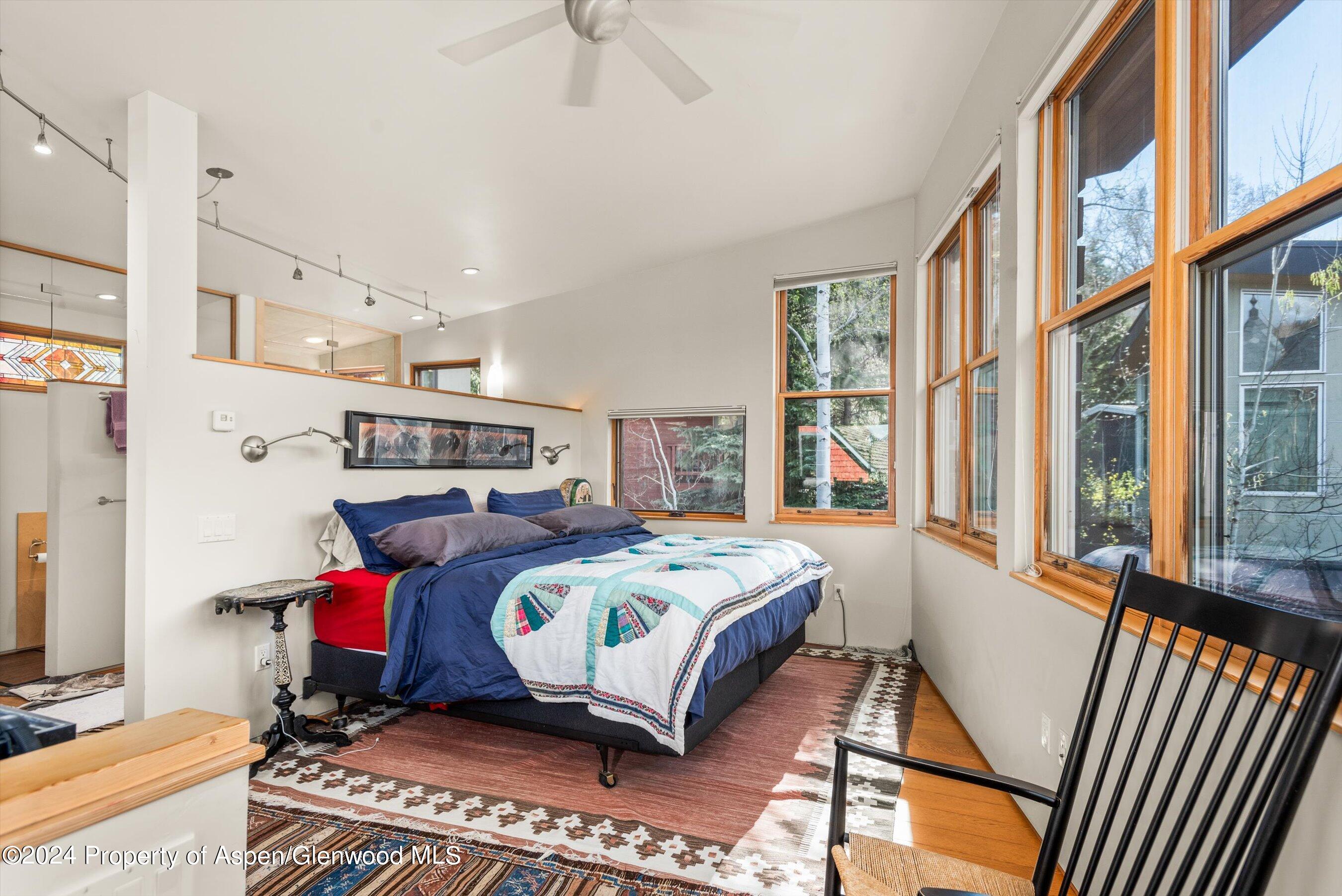 308 Park Avenue Aspen, CO 81611 - Photo 10 of 26 a bedroom with a bed and a window