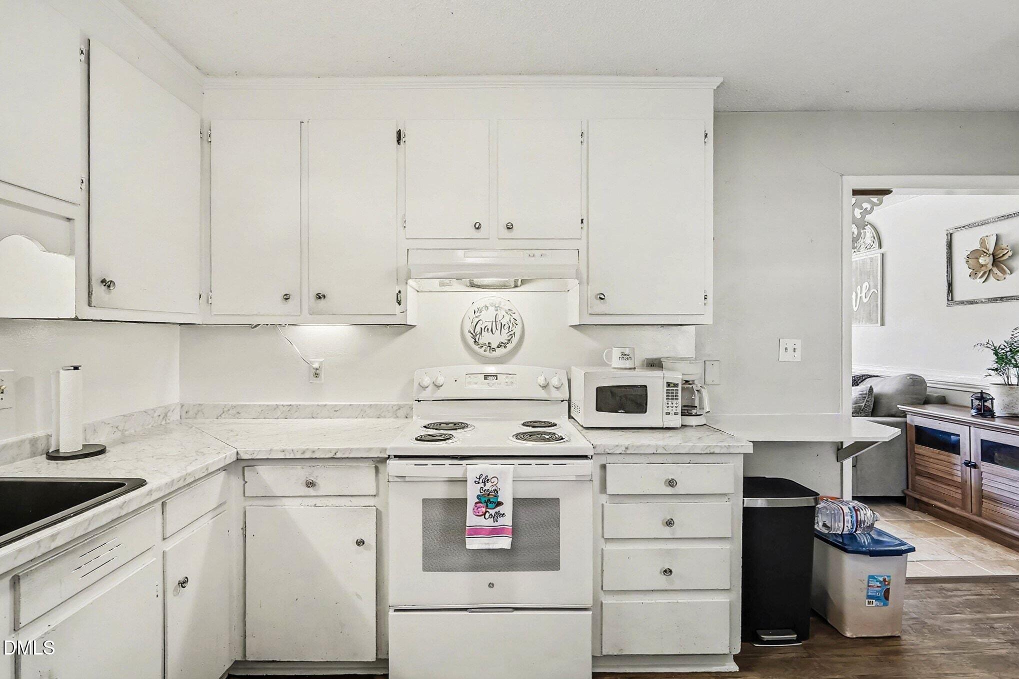 104 Rosebud Street Spring Lake, NC 28390 - Photo 10 of 29 a kitchen with cabinets appliances and a sink