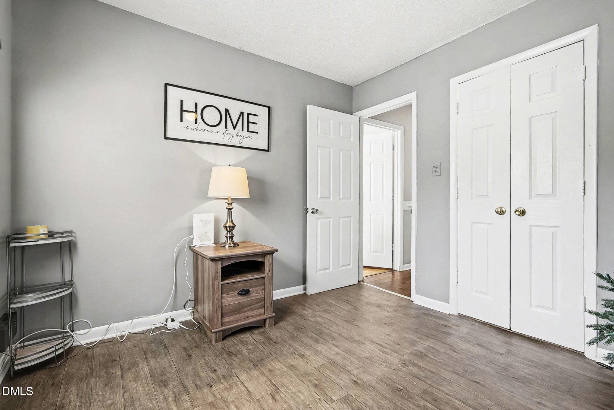 104 Rosebud Street Spring Lake, NC 28390 - Photo 14 of 29 a view of livingroom with hardwood floor and cabinet