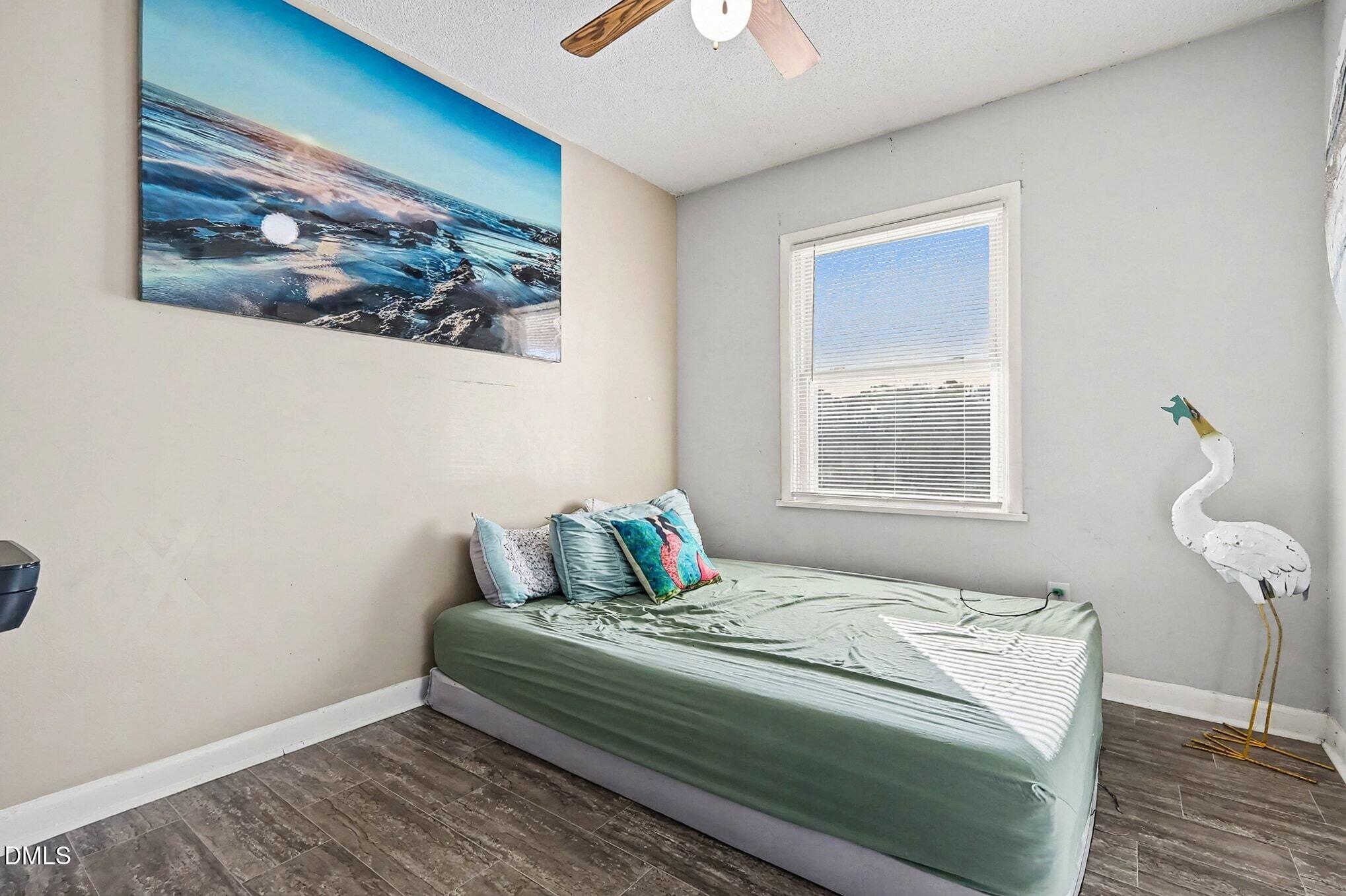 104 Rosebud Street Spring Lake, NC 28390 - Photo 17 of 29 a bedroom with a bed and a window