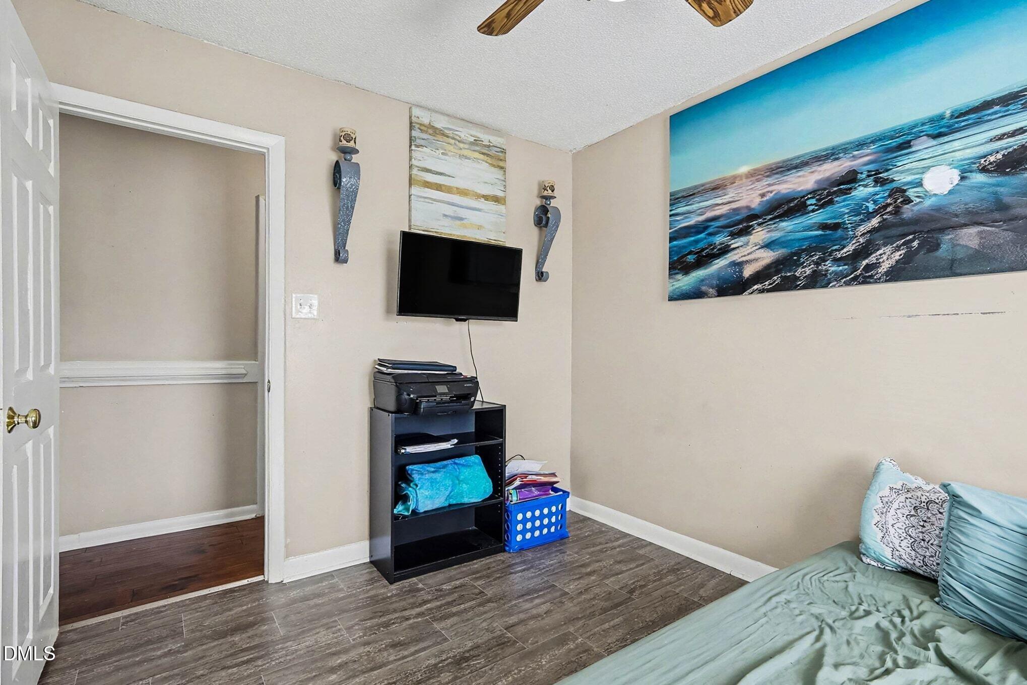 104 Rosebud Street Spring Lake, NC 28390 - Photo 19 of 29 a living room with furniture and a flat screen tv