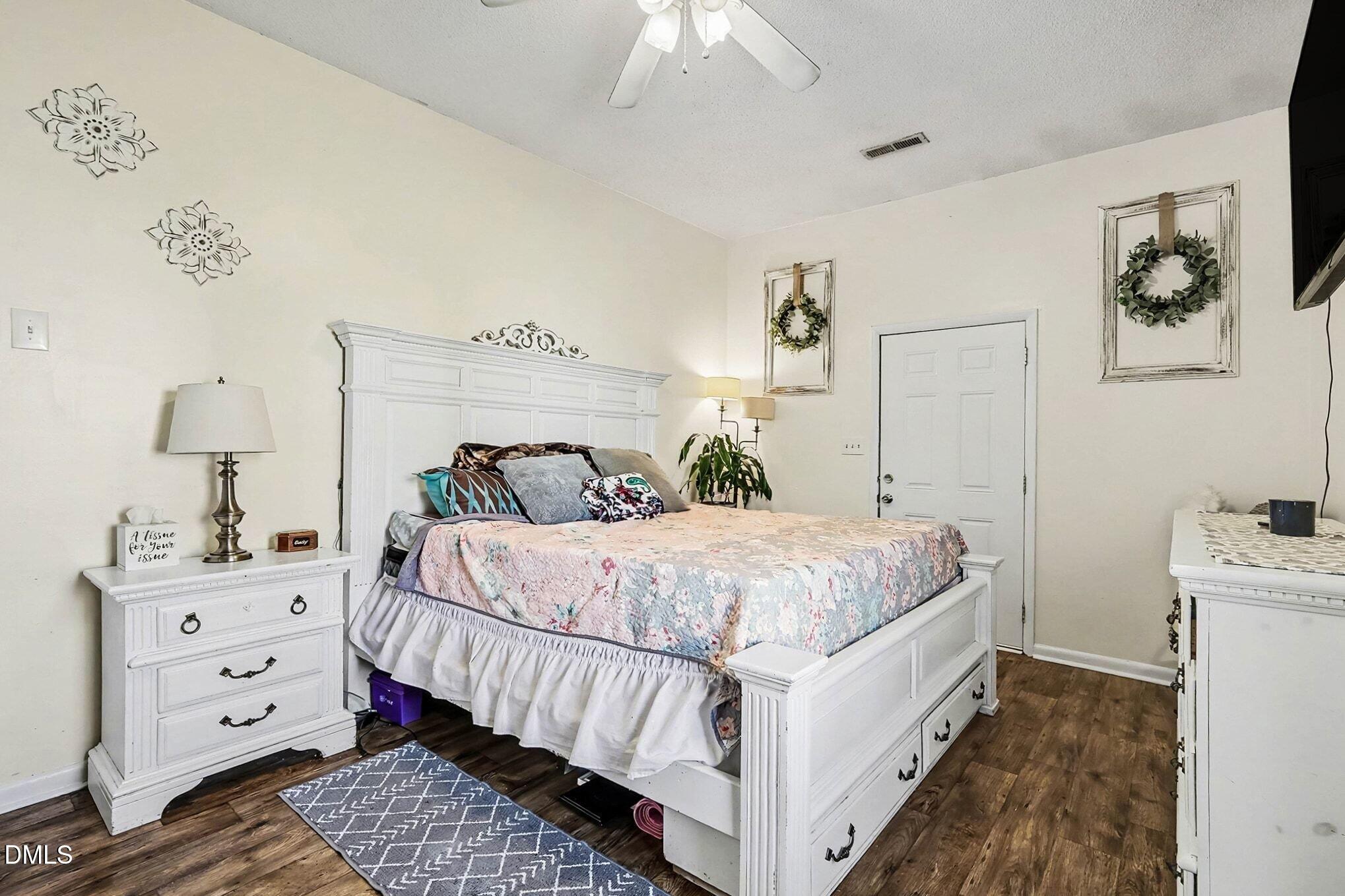 104 Rosebud Street Spring Lake, NC 28390 - Photo 21 of 29 a bedroom with a bed and a dresser
