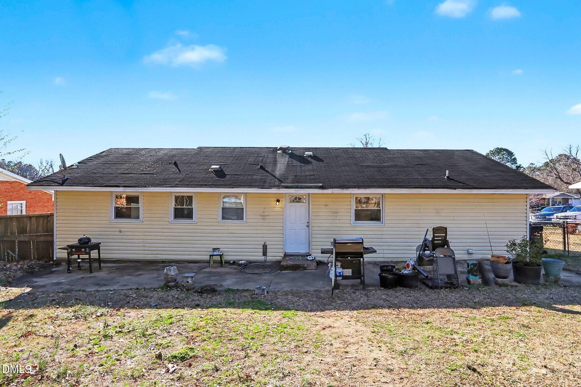 104 Rosebud Street Spring Lake, NC 28390 - Photo 26 of 29 a view of house with outdoor seating space