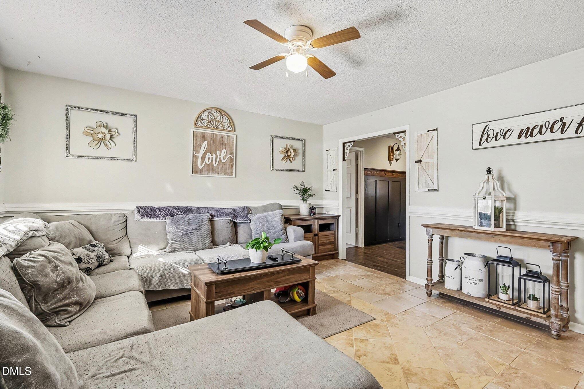 104 Rosebud Street Spring Lake, NC 28390 - Photo 7 of 29 a living room with furniture and a refrigerator