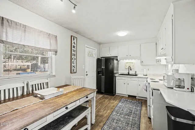 a living room with furniture ceiling fan and a window