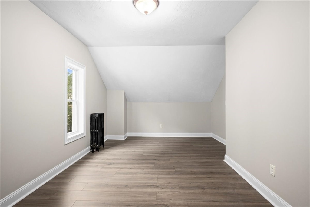 36 Cedar Street, Unit 2A Worcester, MA 01609 - Photo 13 of 26 a view of an empty room with wooden floor and a window