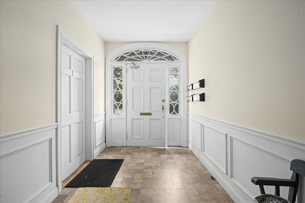 36 Cedar Street, Unit 2A Worcester, MA 01609 - Photo 17 of 26 a view of a hallway with wooden floor and a living room