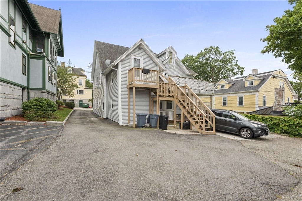 36 Cedar Street, Unit 2A Worcester, MA 01609 - Photo 22 of 26 a view of a white house with large windows