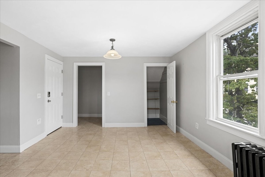 36 Cedar Street, Unit 2A Worcester, MA 01609 - Photo 5 of 26 a view of an empty room with a window