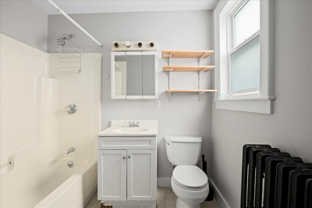36 Cedar Street, Unit 2A Worcester, MA 01609 - Photo 10 of 26 a bathroom with a sink toilet and shower