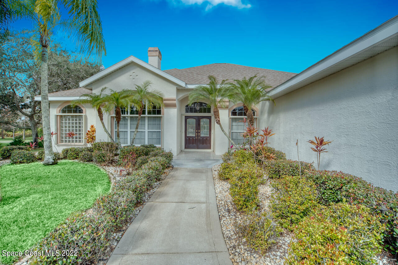 4099 Sparrow Hawk Road Melbourne, FL 32934 - Photo 20 of 48 a front view of a house with garden