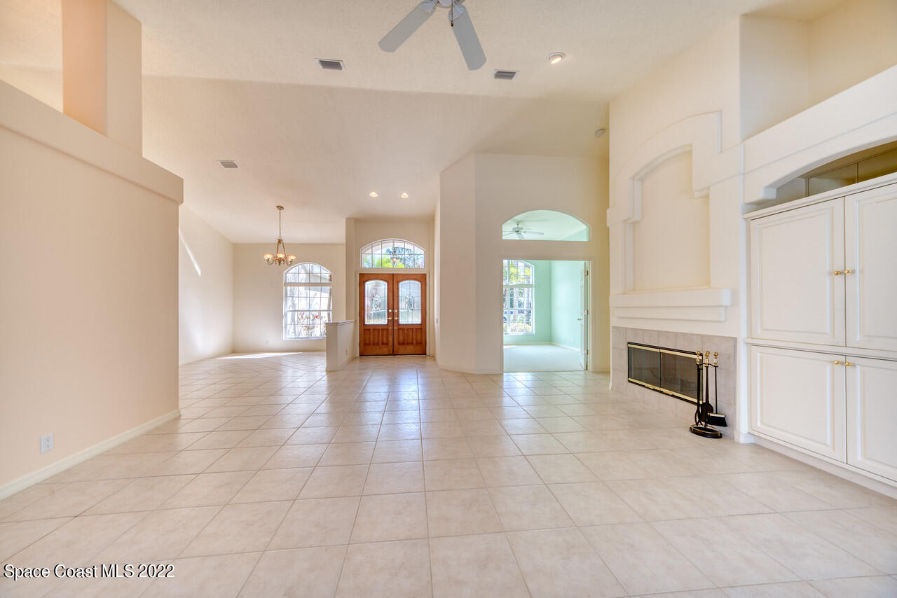 4099 Sparrow Hawk Road Melbourne, FL 32934 - Photo 23 of 48 a view of a kitchen with a sink and a fireplace