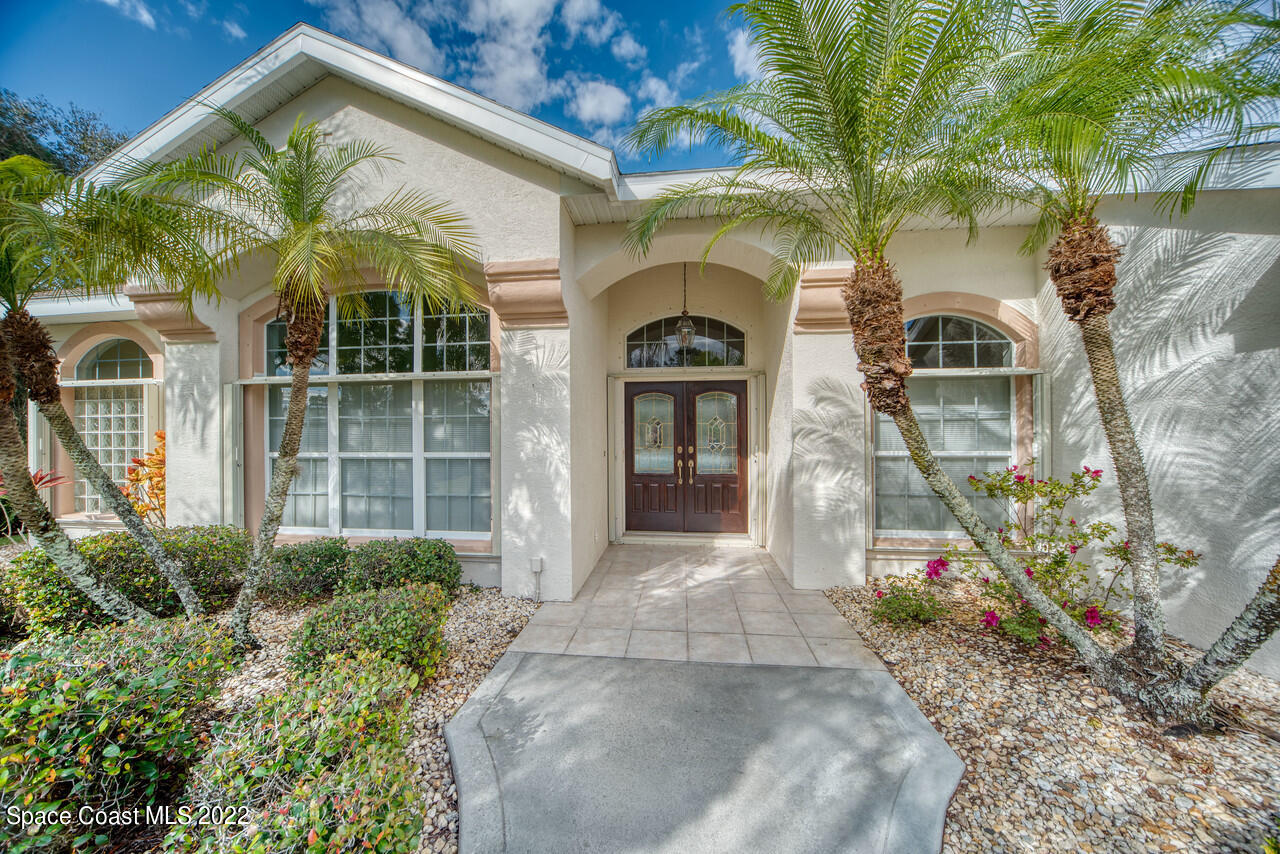4099 Sparrow Hawk Road Melbourne, FL 32934 - Photo 4 of 48 a front view of a house with a porch