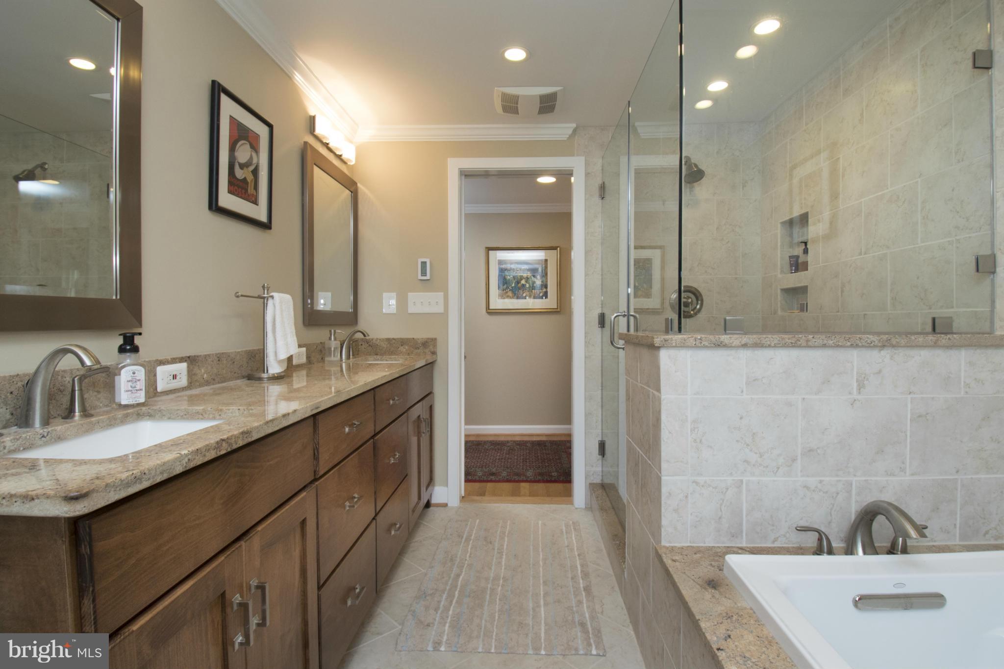 12421 Over Ridge Road Potomac, MD 20854 - Photo 21 of 30 a bathroom with a double vanity sink a mirror and a shower