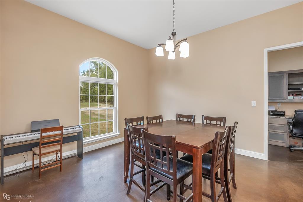 495 John Gloster, LA 71030 - Photo 15 of 40 a view of a dining room with furniture window and wooden floor