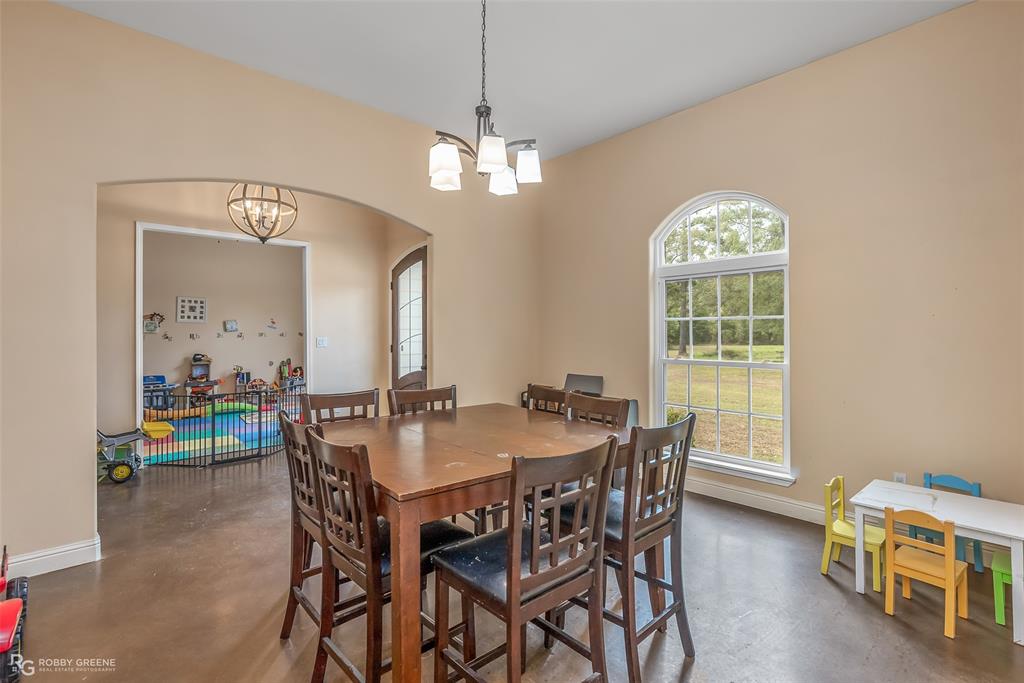 495 John Gloster, LA 71030 - Photo 16 of 40 a view of a dining room with furniture and a chandelier