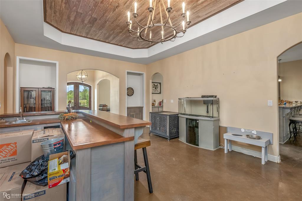 495 John Gloster, LA 71030 - Photo 19 of 40 a living room with stainless steel appliances furniture and a chandelier