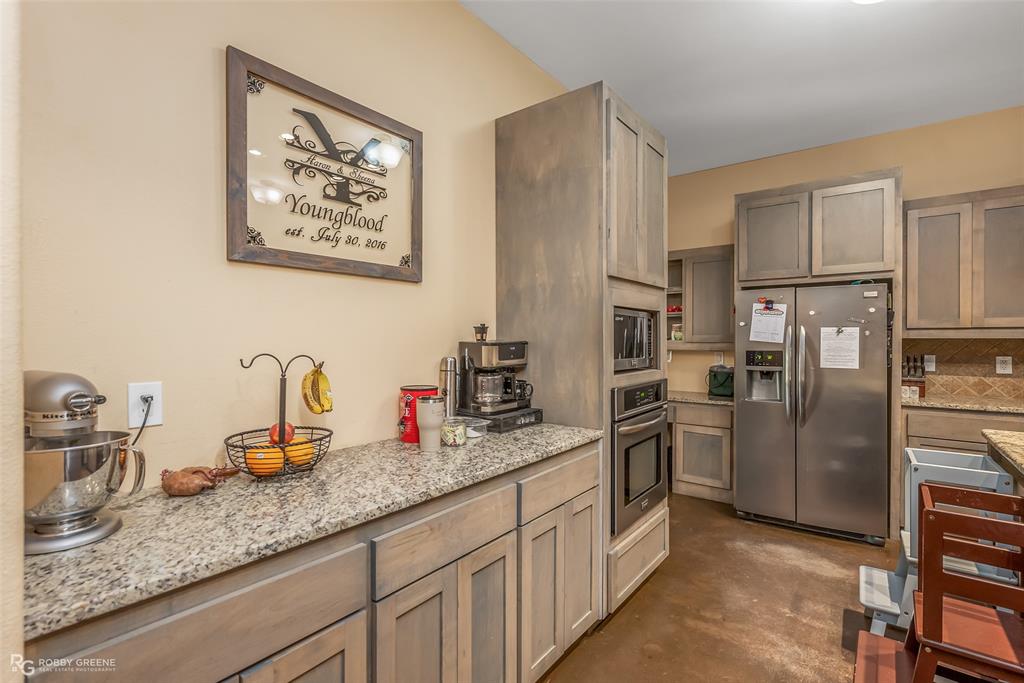 495 John Gloster, LA 71030 - Photo 24 of 40 a kitchen with stainless steel appliances granite countertop a refrigerator and a sink