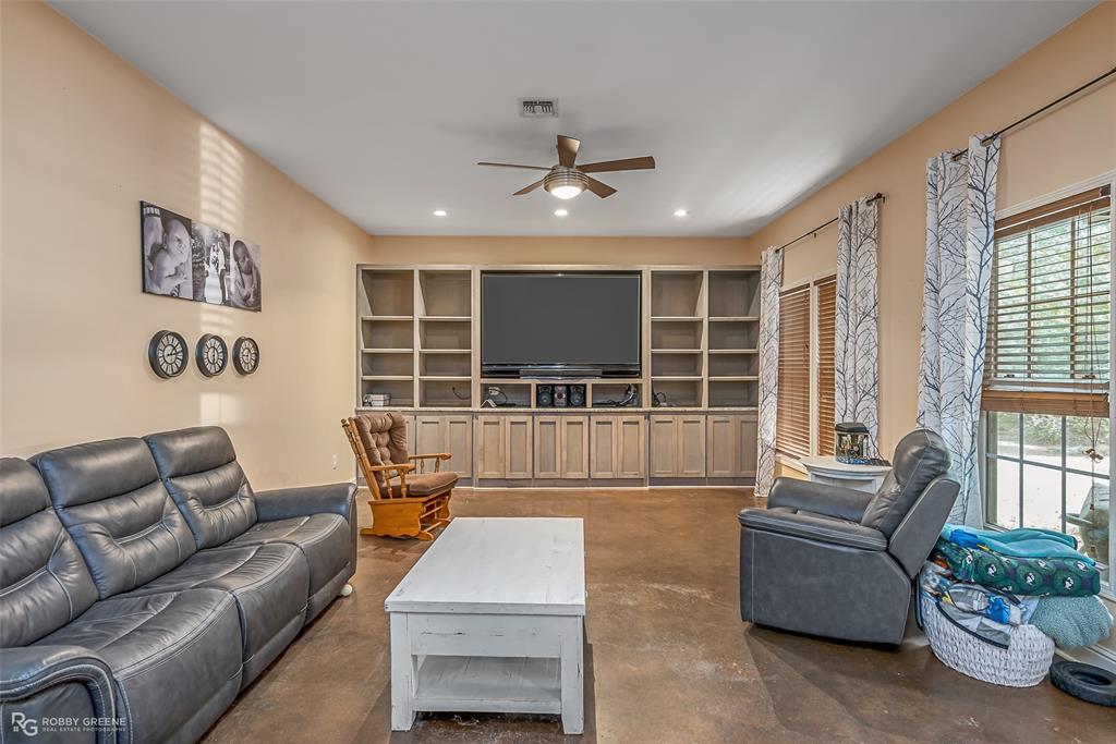 495 John Gloster, LA 71030 - Photo 27 of 40 a living room with furniture and a large window