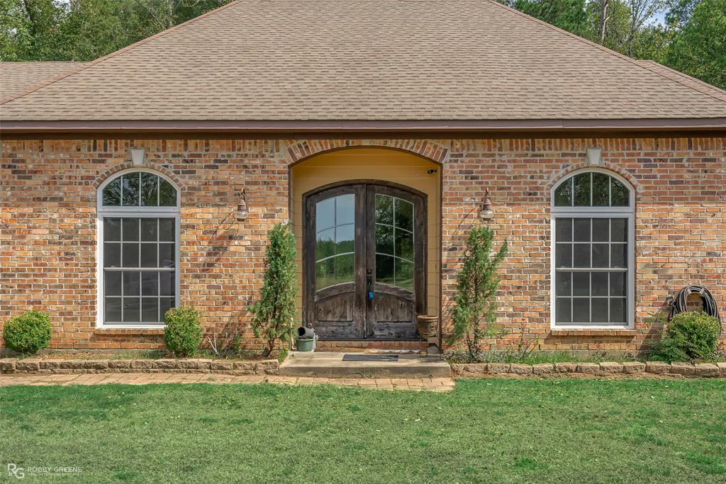 495 John Gloster, LA 71030 - Photo 3 of 40 a front view of a house with a garden