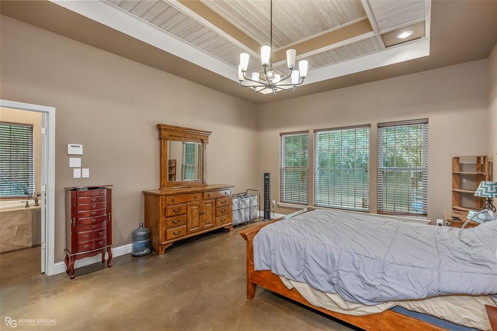 495 John Gloster, LA 71030 - Photo 31 of 40 a bedroom with a bed and a large window