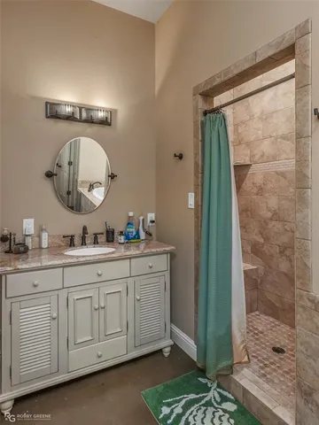 a bathroom with bathtub and window