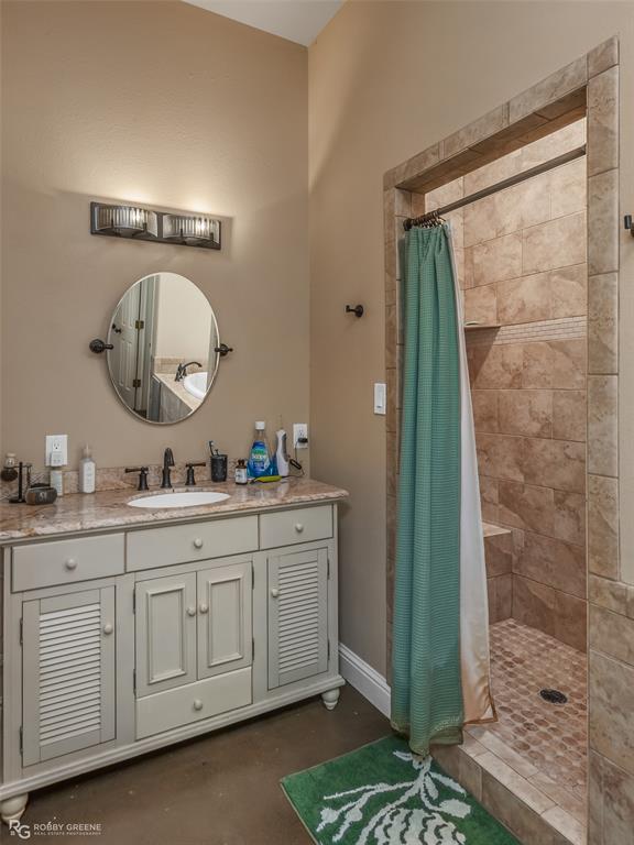 495 John Gloster, LA 71030 - Photo 33 of 40 a spacious bathroom with a double vanity sink a mirror and a shower