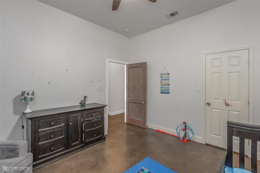 495 John Gloster, LA 71030 - Photo 38 of 40 a room with a dresser and a wooden floor