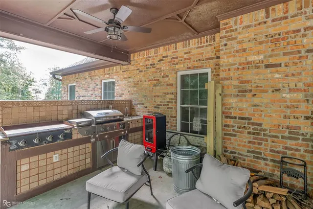 a view of a patio with table and chairs