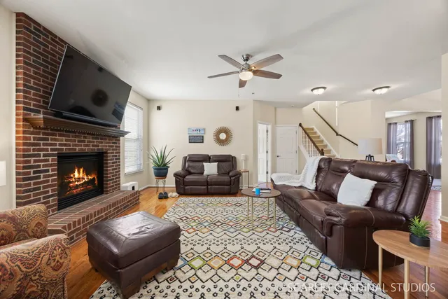 a living room with furniture and a fireplace
