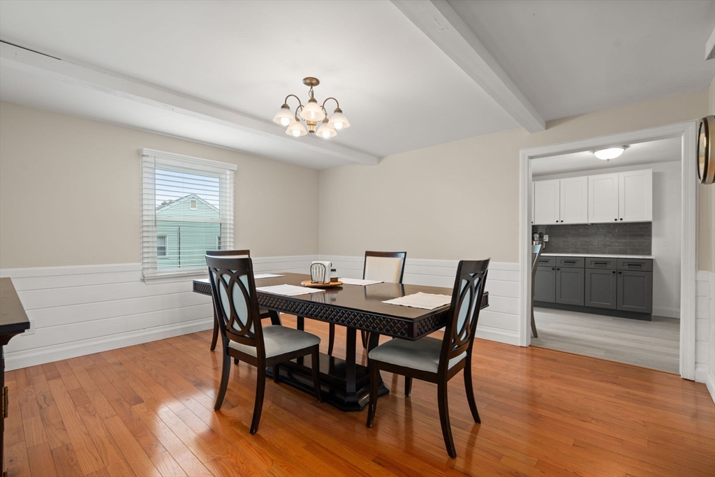9 Laurel Lane Bellingham, MA 02019 - Photo 15 of 30 a view of a dining room with furniture wooden floor and a chandelier