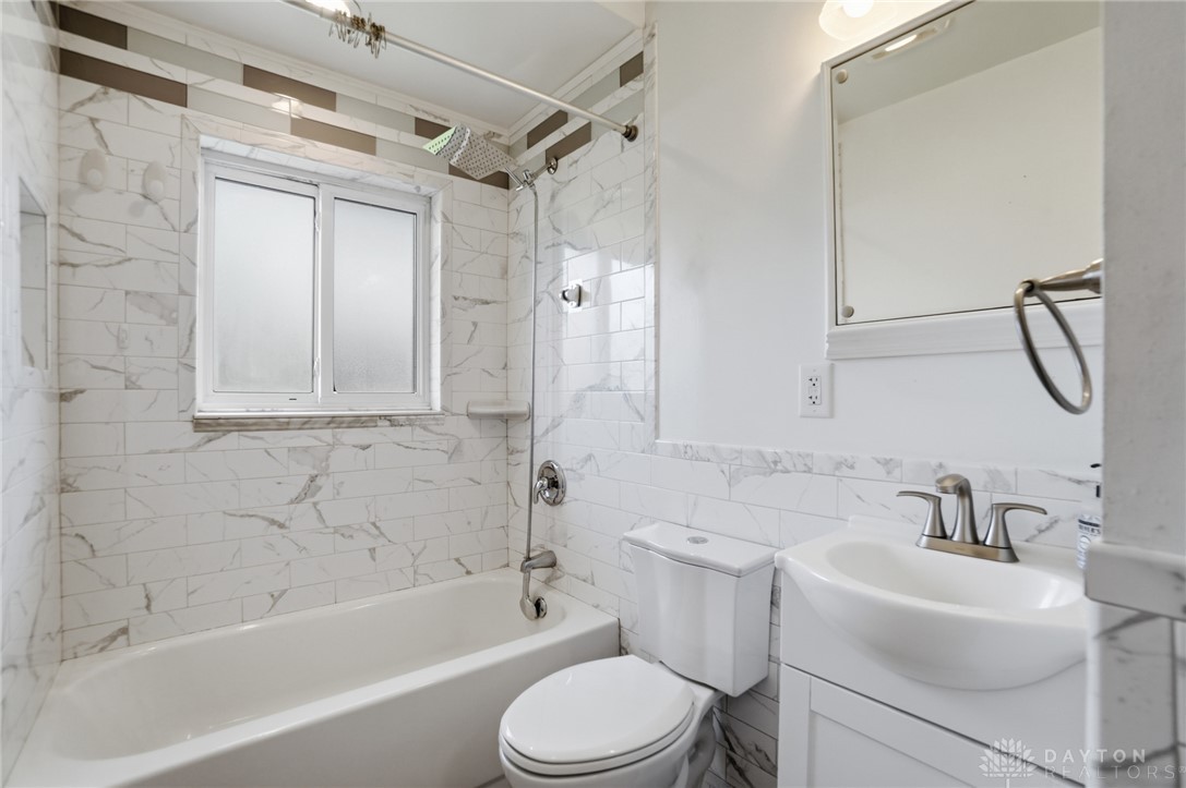 629 Storms Road Dayton, OH 45429 - Photo 35 of 51 This bathroom features a sleek vanity and modern fixtures, creating a clean and refreshing retreat.