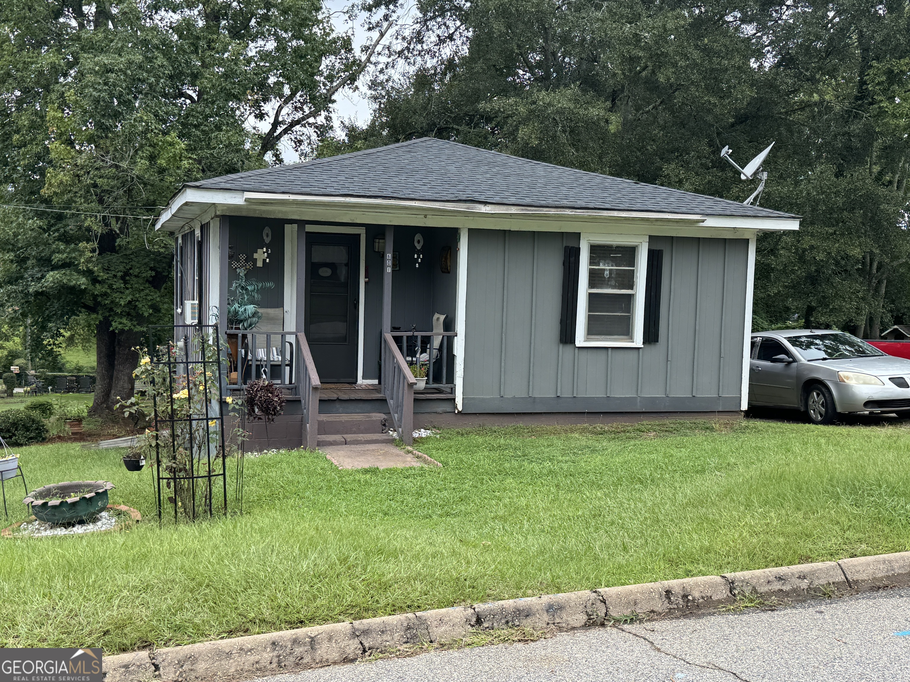 32 Unit Mutlipl Multiple Griffin, GA 30223 - Photo 13 of 24 a front view of a house with a yard table and chairs