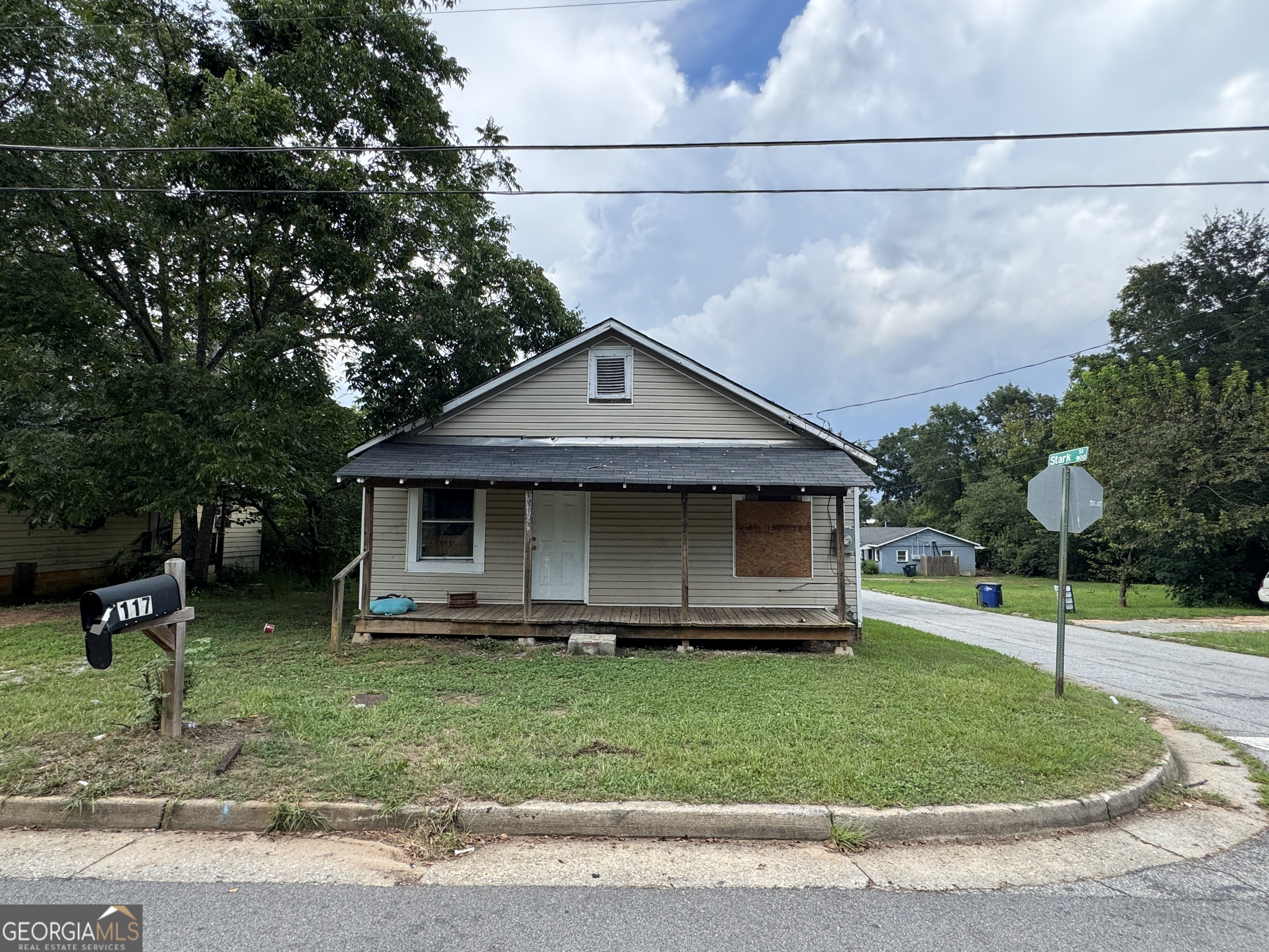 32 Unit Mutlipl Multiple Griffin, GA 30223 - Photo 3 of 24 a front view of a house with a garden and trees