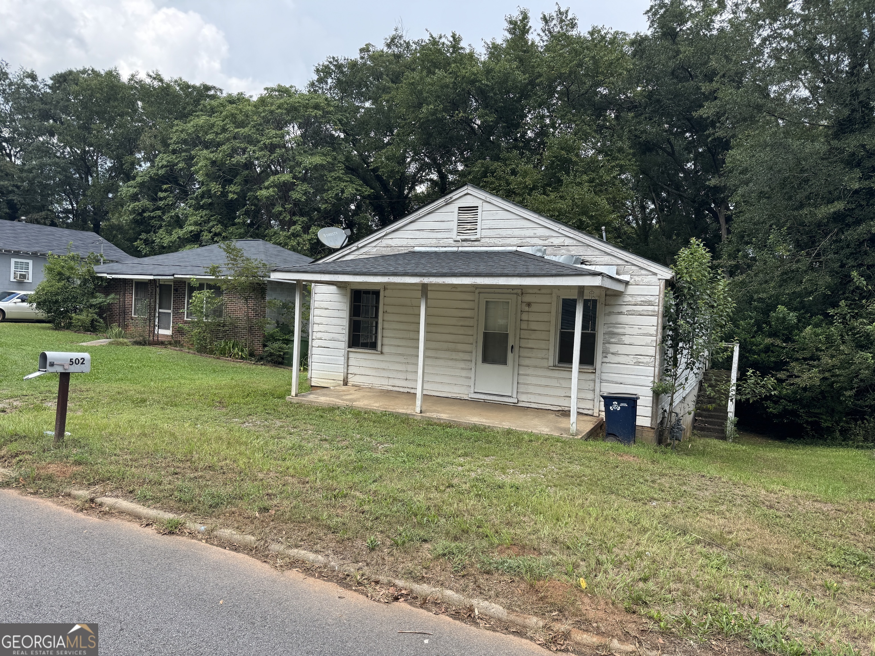 32 Unit Mutlipl Multiple Griffin, GA 30223 - Photo 9 of 24 a front view of a house with a yard and trees