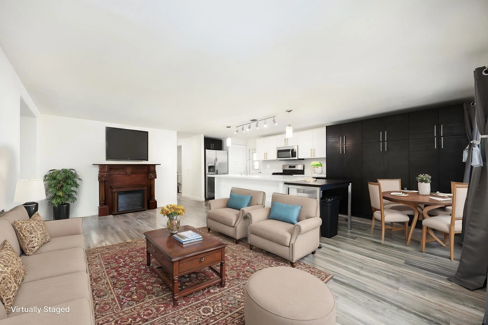 1815 Sweetwater Road, Unit SPC 121 Spring Valley, CA 91977 - Photo 11 of 44 a living room with furniture a fireplace and a flat screen tv