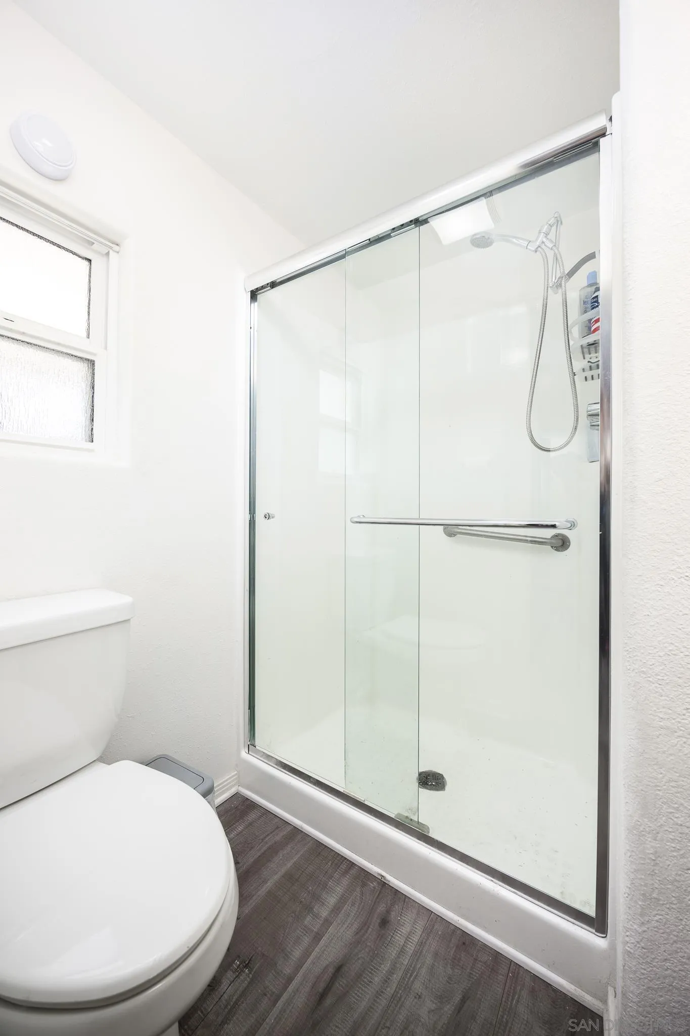 1815 Sweetwater Road, Unit SPC 121 Spring Valley, CA 91977 - Photo 17 of 44 a white toilet sitting next to a shower