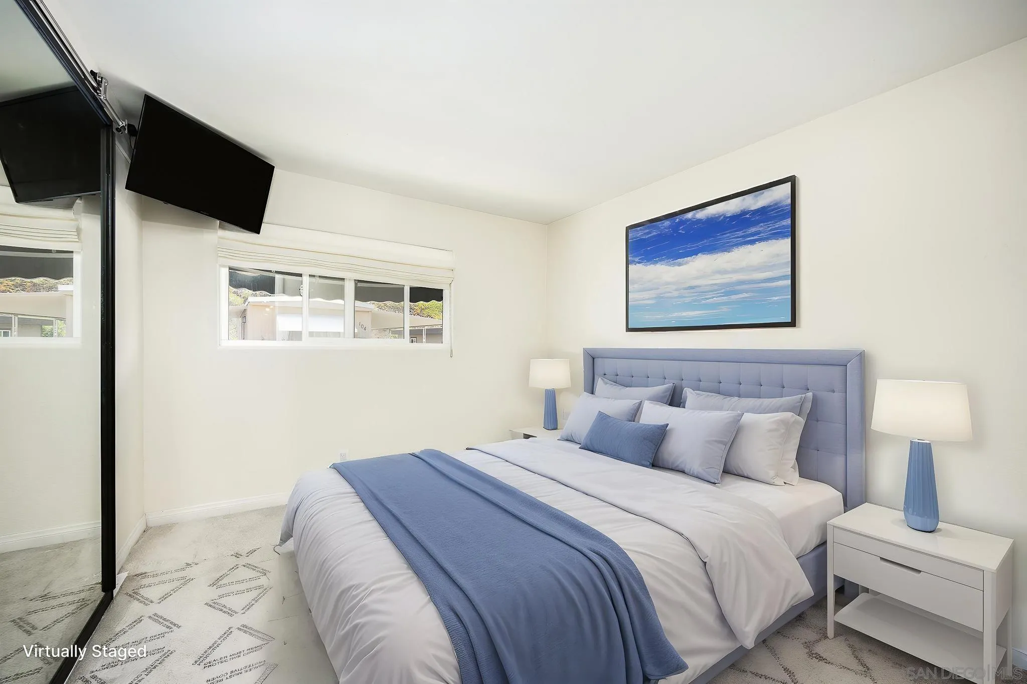 1815 Sweetwater Road, Unit SPC 121 Spring Valley, CA 91977 - Photo 18 of 44 a bedroom with a bed and a flat screen tv