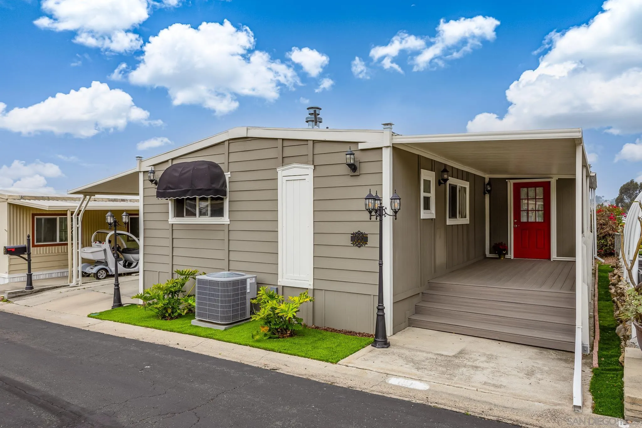 1815 Sweetwater Road, Unit SPC 121 Spring Valley, CA 91977 - Photo 2 of 44 a front view of a house with plants