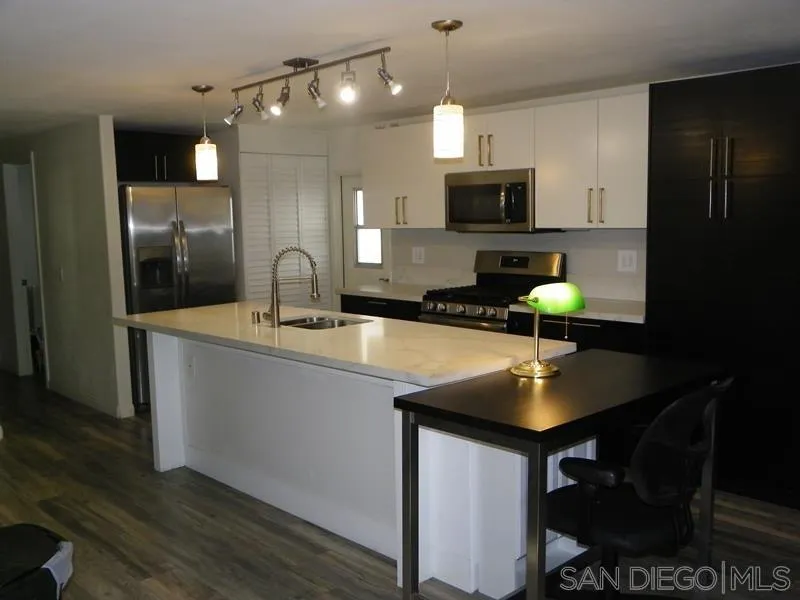 1815 Sweetwater Road, Unit SPC 121 Spring Valley, CA 91977 - Photo 36 of 44 a kitchen with a sink cabinets and stainless steel appliances