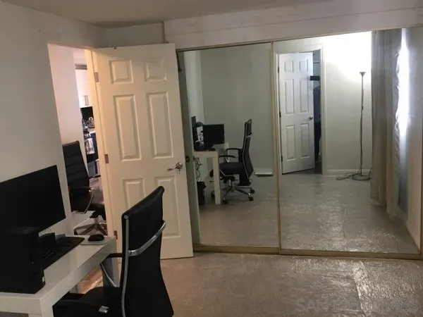 a kitchen with a table and chairs in it