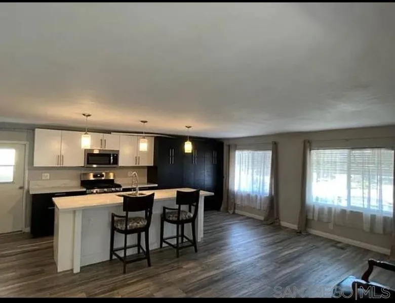 1815 Sweetwater Road, Unit SPC 121 Spring Valley, CA 91977 - Photo 40 of 44 a kitchen with a table and chairs in it