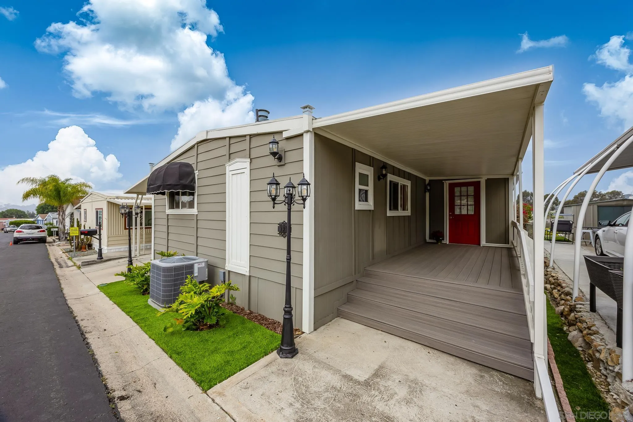 1815 Sweetwater Road, Unit SPC 121 Spring Valley, CA 91977 - Photo 5 of 44 a view of a house with a yard