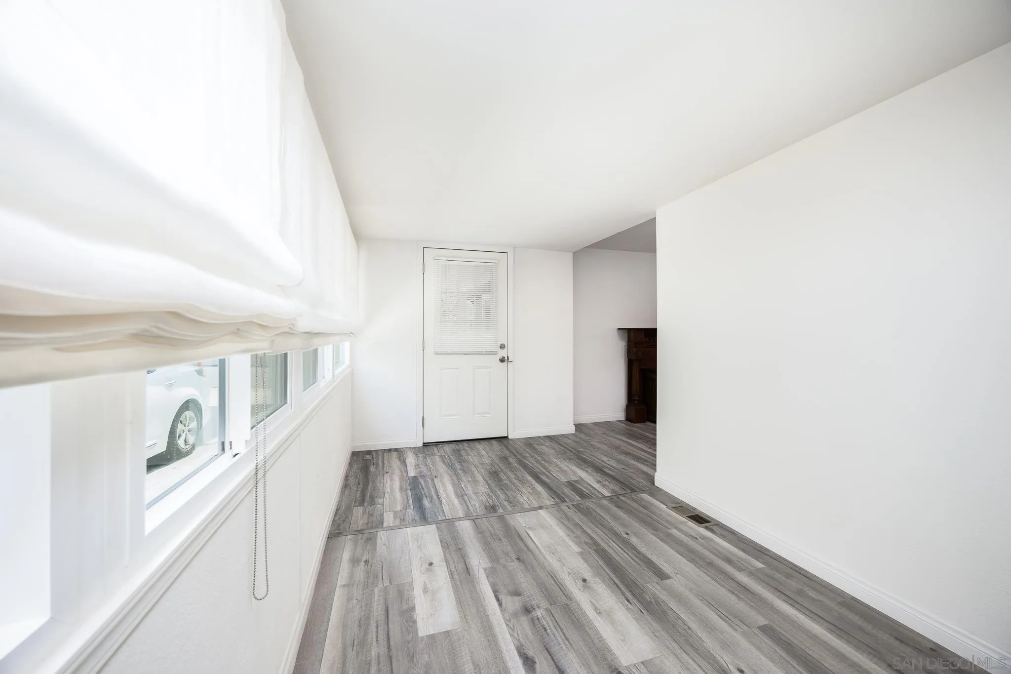 1815 Sweetwater Road, Unit SPC 121 Spring Valley, CA 91977 - Photo 8 of 44 a view of an empty room with wooden floor