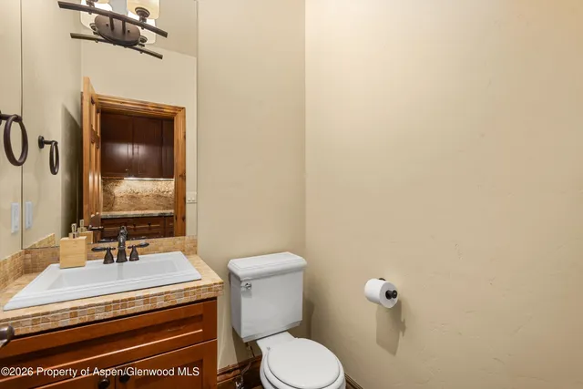 a bathroom with a toilet and a sink