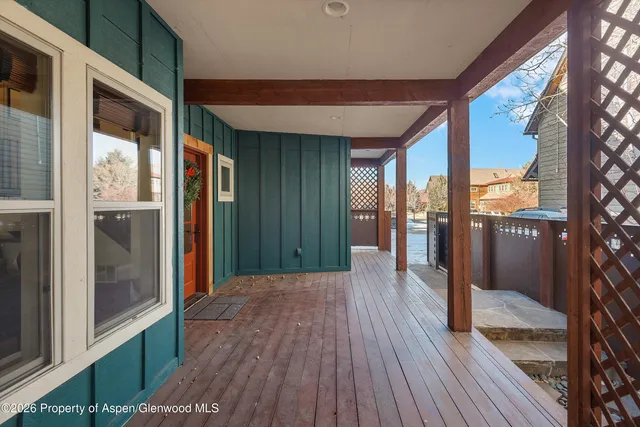 a view of a porch with wooden floor and outdoor space
