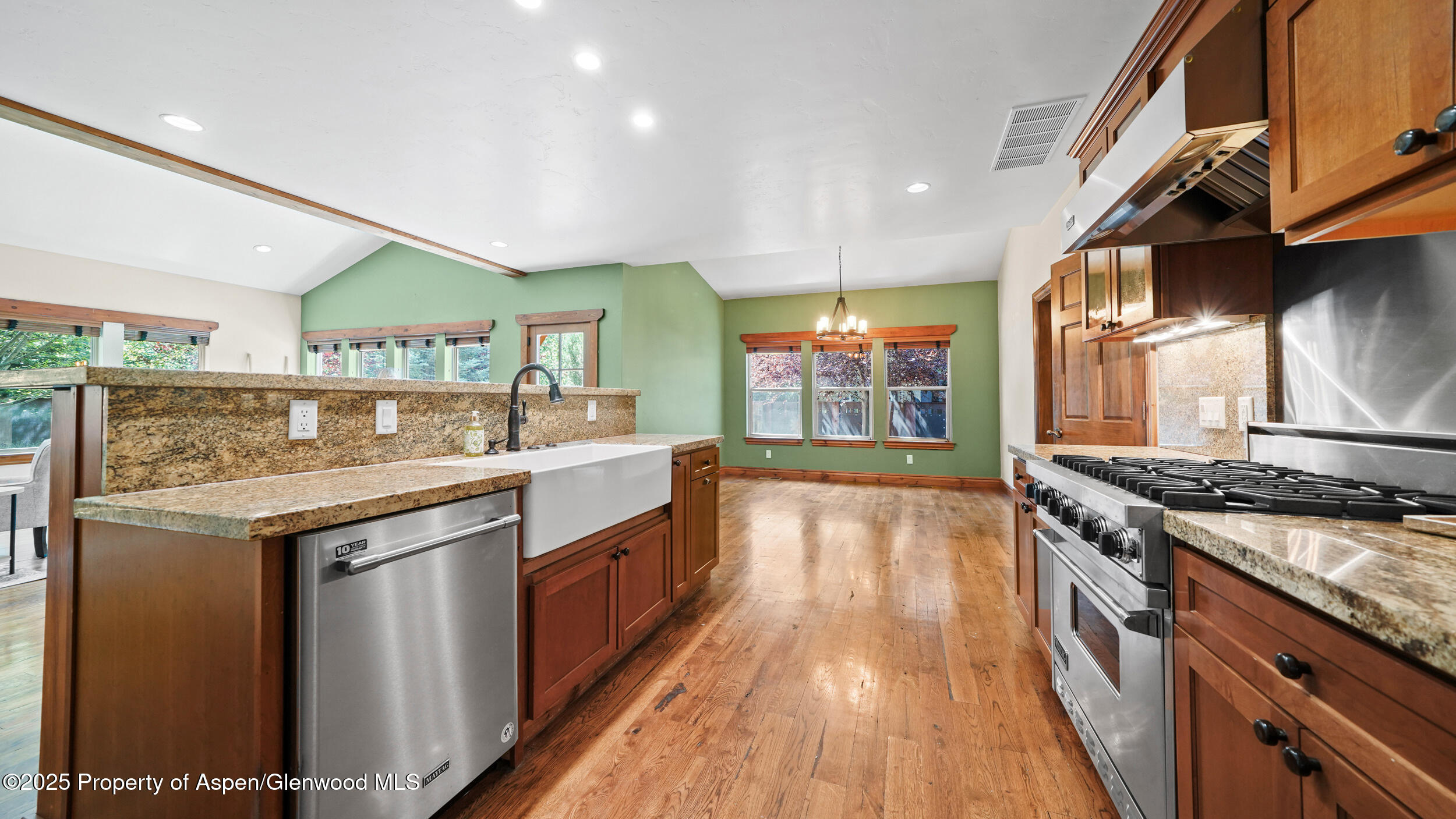 225 Juniper Court Basalt, CO 81621 - Photo 3 of 5 a kitchen with stainless steel appliances granite countertop a stove and a sink