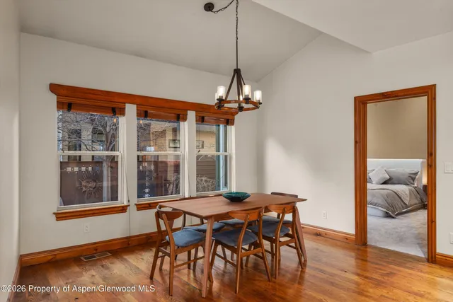 a dining room with furniture and window