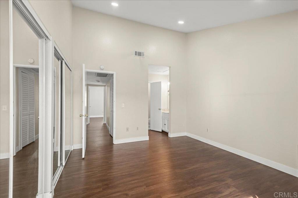 389 Shady Lane, Unit D El Cajon, CA 92021 - Photo 23 of 30 a view of a hallway with wooden floor